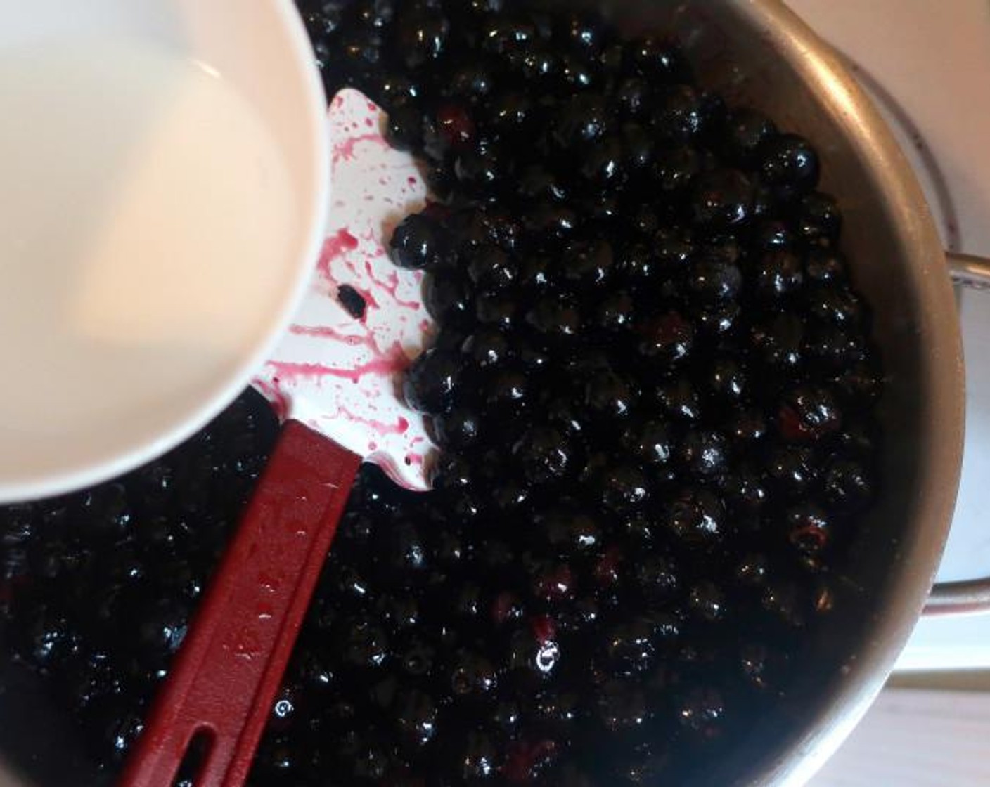 step 4 Melt Butter (1 stick) add washed and dried Fresh Blueberries (4 cups), when simmering, add Corn Starch (1 tsp) and Water (1/2 Tbsp) mixed to make a cornstarch slurry, simmer a few more seconds, remove from heat.