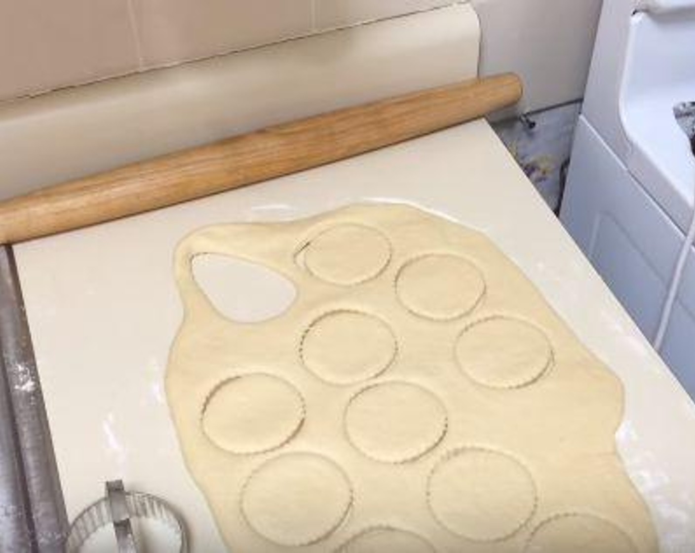 step 6 Flour a surface and roll out the dough. Using a cookie cutter or another round object, cut out the doughnut rounds and place on a baking sheet. Cover and let rise for 30 minutes.