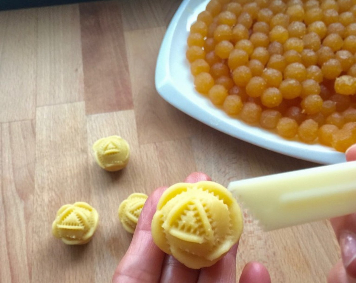 step 16 Using a plastic crimper, crimp the rolled pineapple tart into a rose shape.