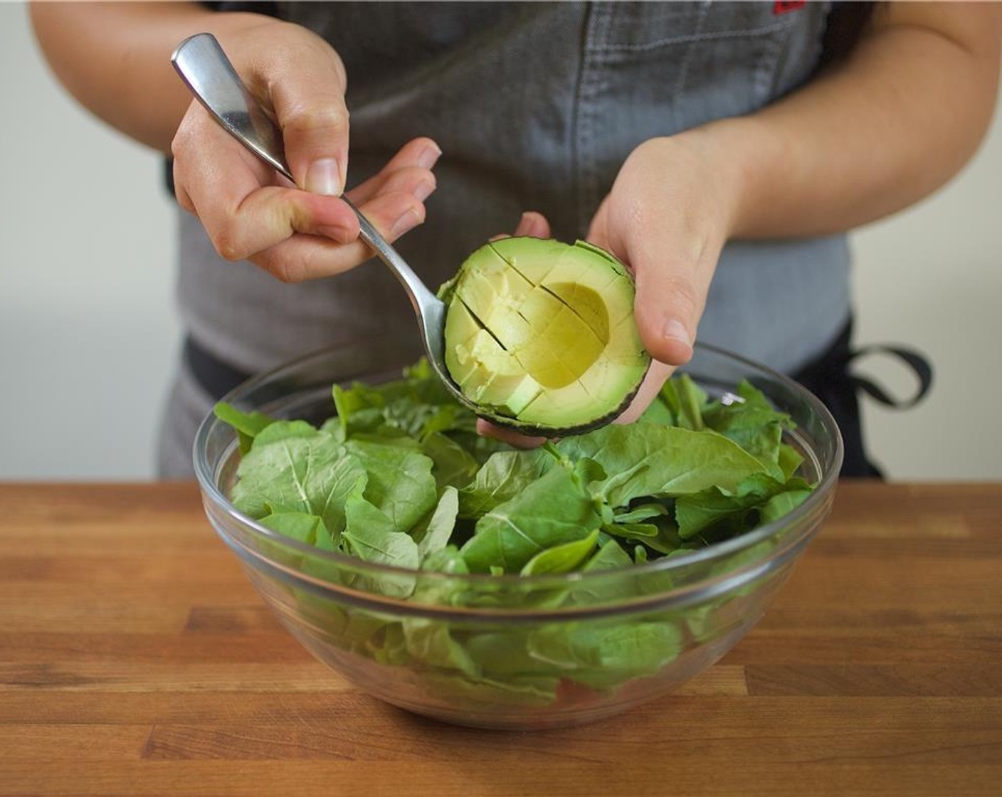 step 11 Add the Arugula (2 3/4 cups), potatoes, and croutons to the large bowl. Top with Avocado (1).