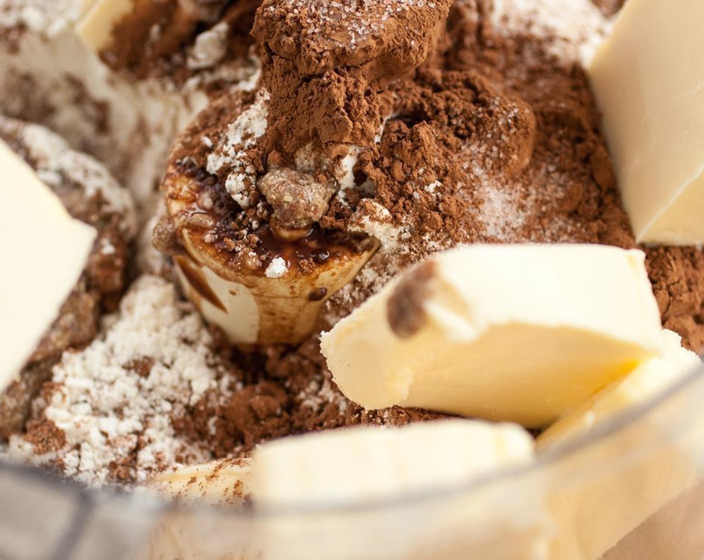 step 1 In a food processor, using the dough hook attachment, combine Ground Flaxseed (2 Tbsp), Water (2 Tbsp), Vegan Butter (2/3 cup), All-Purpose Flour (1 1/2 cups), Powdered Confectioners Sugar (1/2 cup), Vanilla Extract (1/2 tsp), Unsweetened Cocoa Powder (1/4 cup), and Kosher Salt (1/4 tsp).