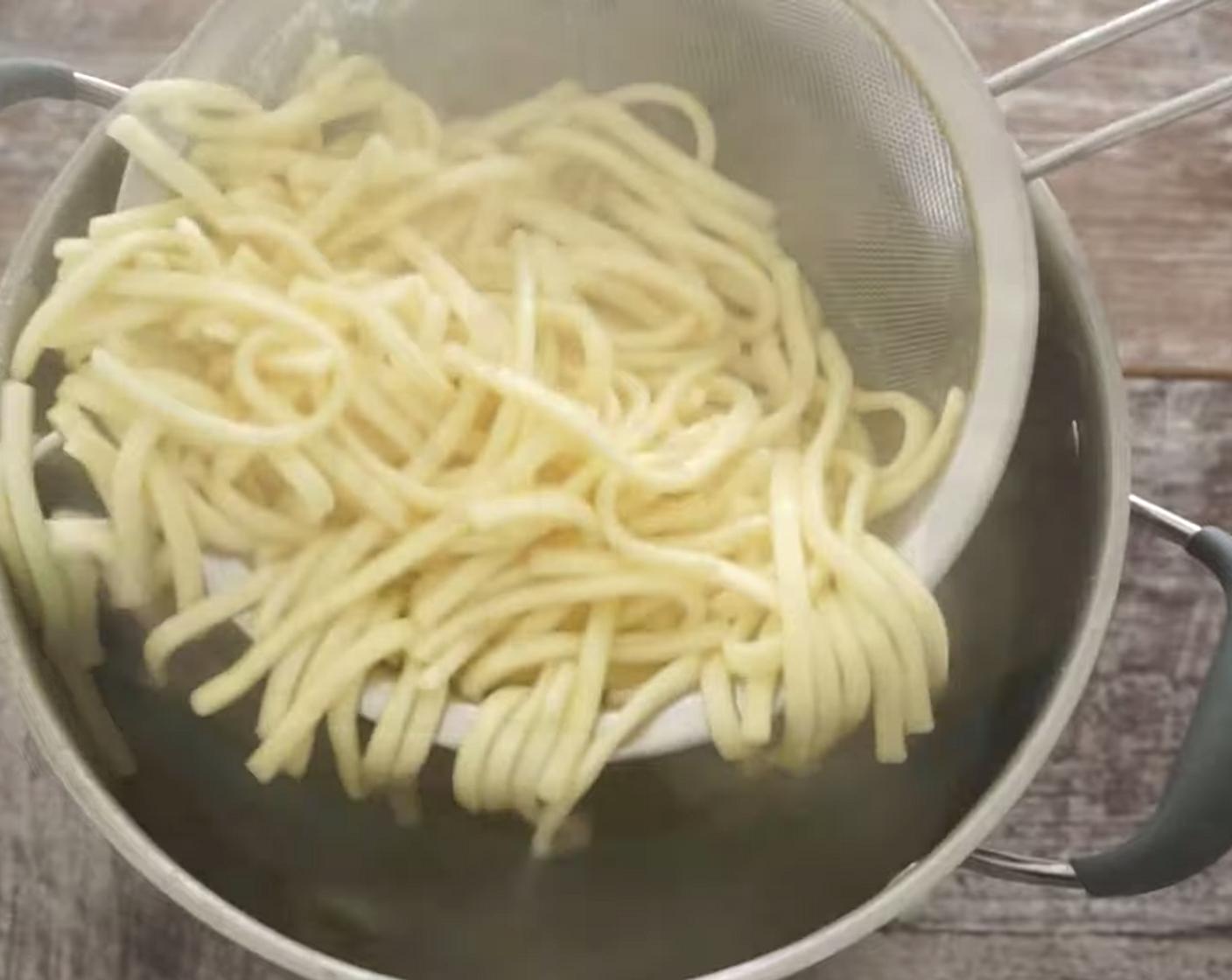 step 3 Next, cook your choice of Pasta (10.5 oz) for the desired cooking time, strain it, then add it to a mixing bowl to cool slightly.