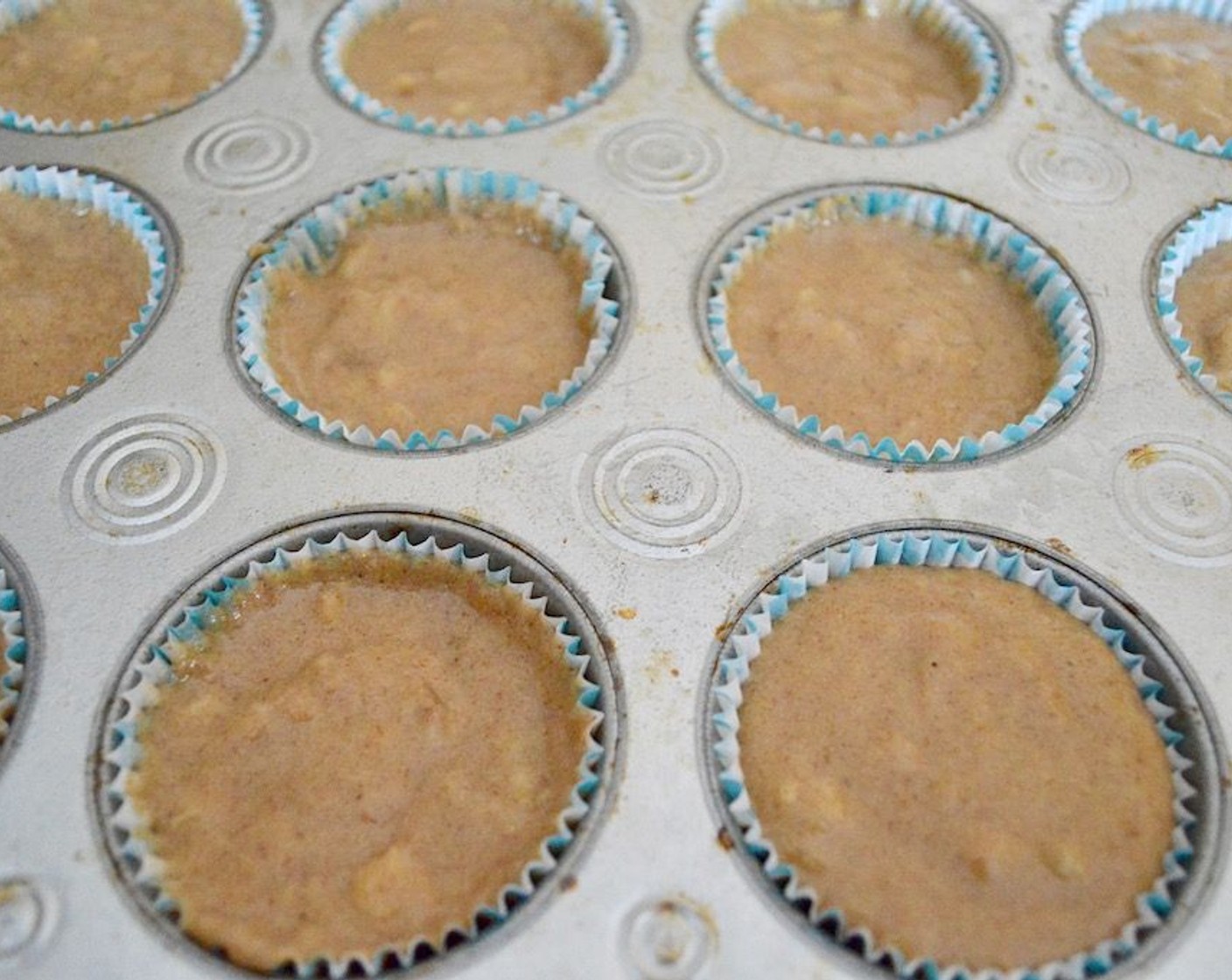 step 5 Evenly divide the batter among the prepared muffin pan, filling each one almost to the top.