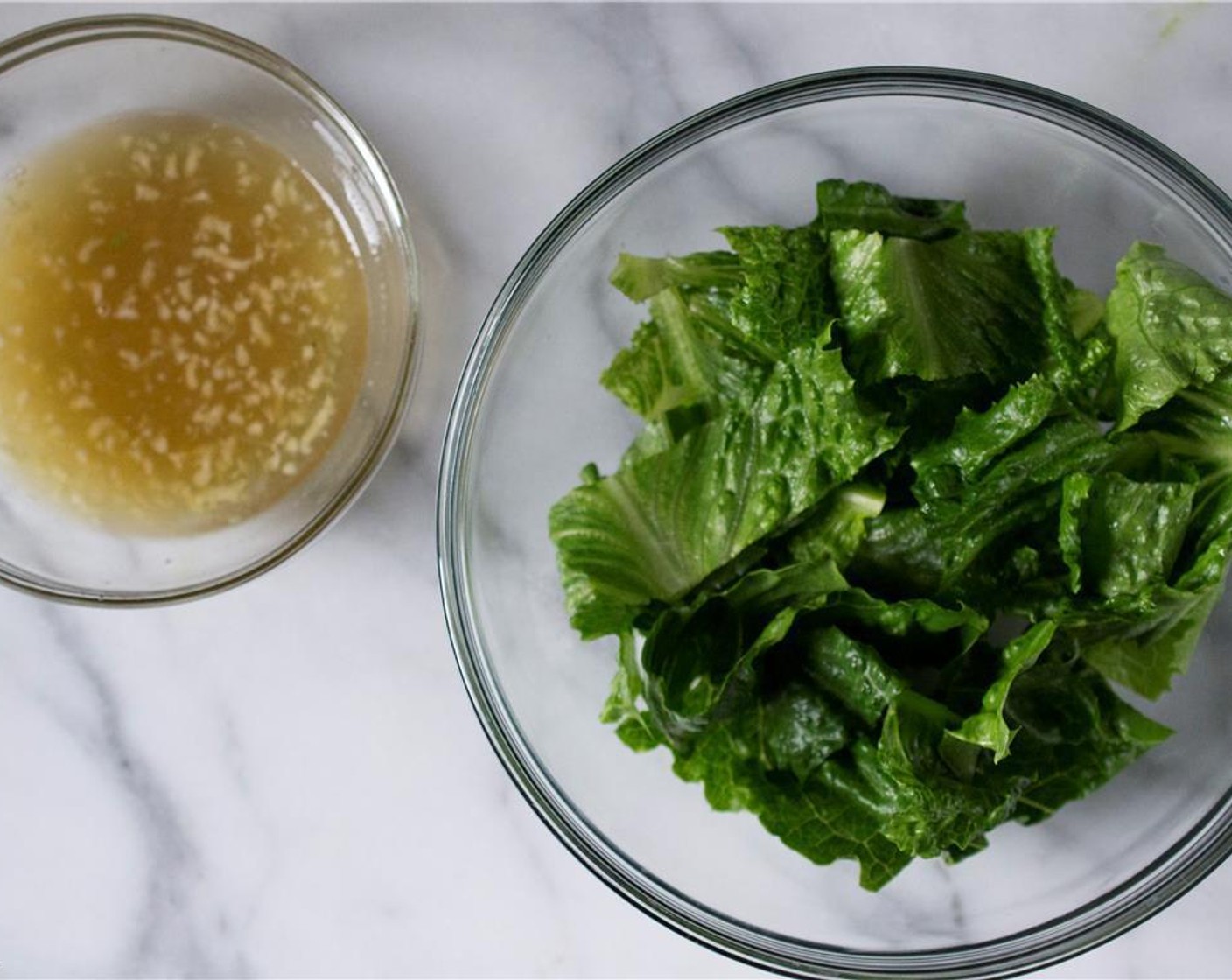 step 5 Just before you’re ready to cook the tuna burgers, make the dressing. In a medium-sized bowl, combine Limes (2), Fish Sauce (1 Tbsp), Orange (1/4), Rice Vinegar (1/2 Tbsp), and Garlic (1 clove). Stir well.