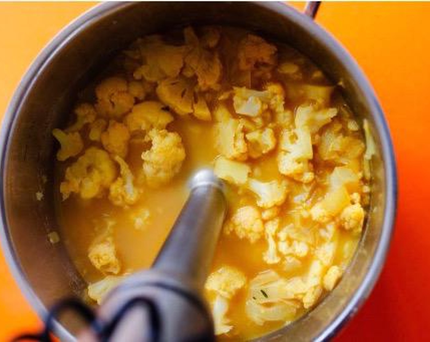 step 2 Add Low-Sodium Vegetable Broth (3 cups), Nutritional Yeast (1/4 cup), and Fresh Thyme (2 sprigs). Roughly chop about 3/4 of the Cauliflower (1 head) and add to the pot. Cover and simmer for 15-20 minutes, until cauliflower is fork-tender.