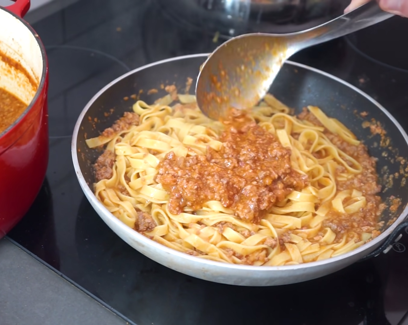 step 15 Mix this through until the pasta is completely lathered before adding another generous amount of Bolognese sauce and mixing again.