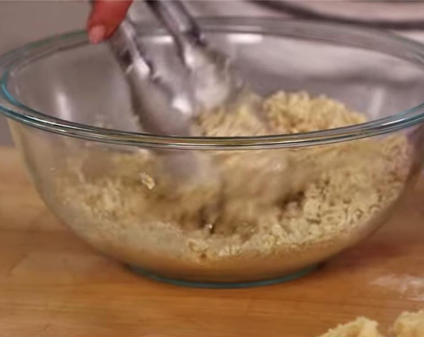 step 8 Dip the par-cooked wings back in the wet batter. You want just enough to coat, so brush off any excess with a food safe brush. Then coat the wings in the crumbled ramen.