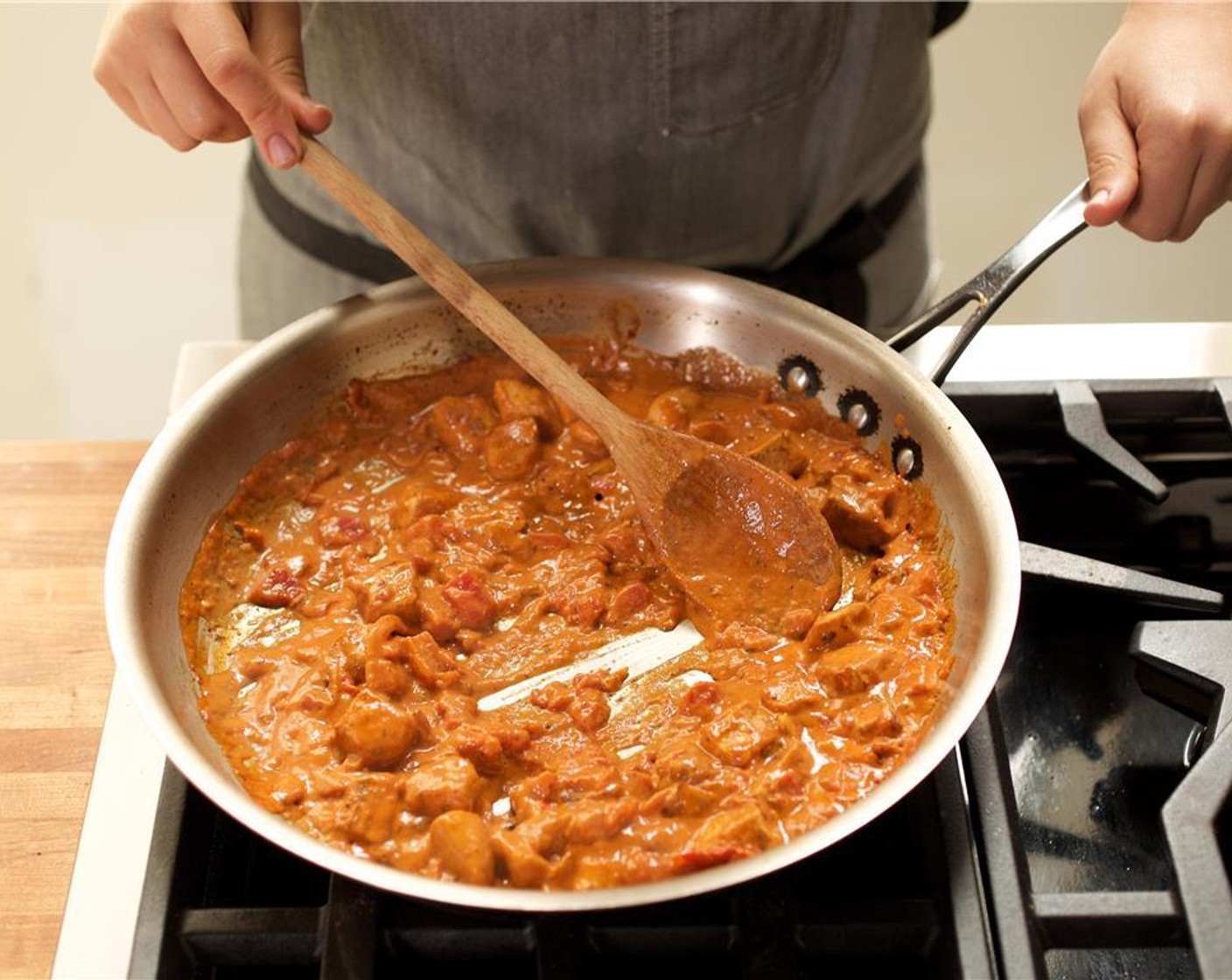 step 12 In the same pan as the chicken, add Coconut Milk (3.5 fl oz), Canned Stewed Tomatoes (3/4 cup), Tomato Sauce (1/2 cup), and Granulated Sugar (4 Tbsp). Stir to combine.