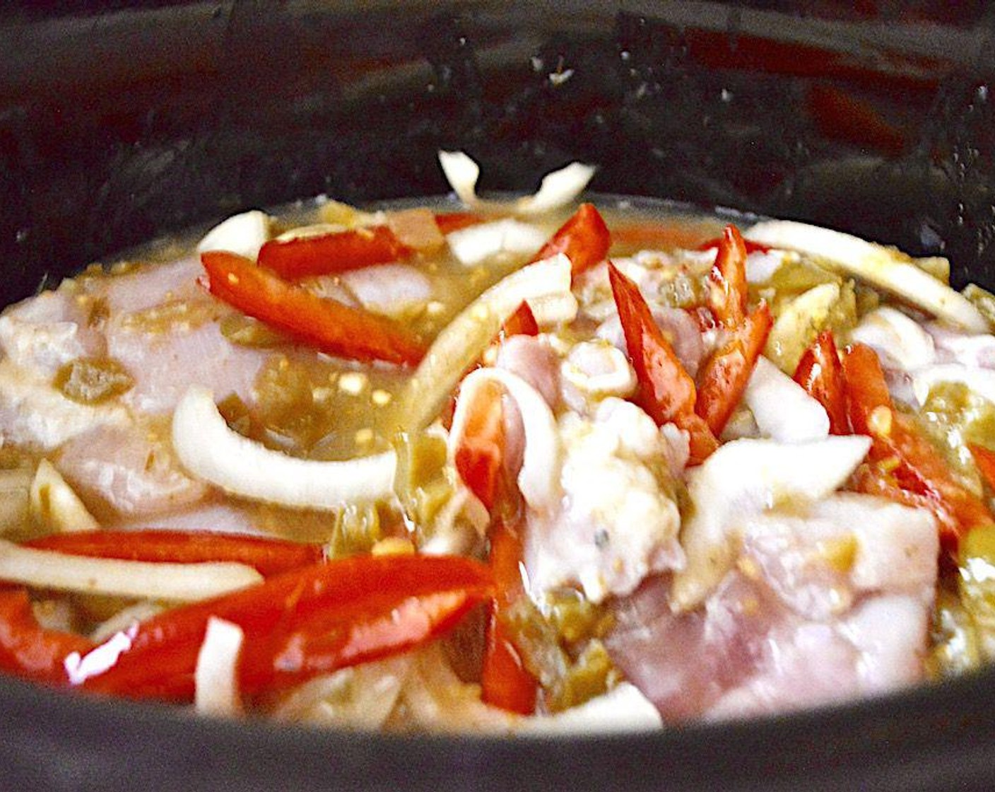 step 1 Set up a slow cooker and combine the Boneless, Skinless Chicken Thighs (1.5 lb), Red Bell Pepper (1), Onion (1), Garlic (2 cloves), Salsa Verde (1 jar), Chicken Stock (1/3 cup), Salt (1 pinch), Ground Black Pepper (1 pinch), and Ground Cumin (1 pinch). Give it a quick stir, then close it up and turn it to low. Let it cook for 5 hours, then open it up and use two forks to give it a stir and shred the chicken up.