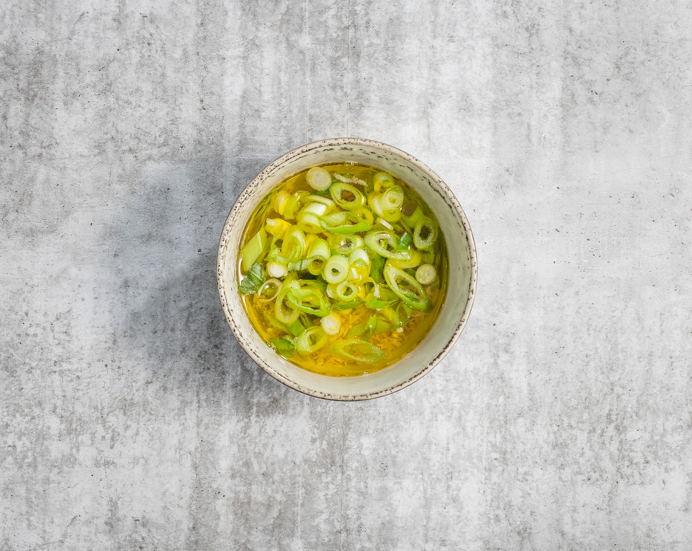 step 5 While the meatballs and vegetables cook, make the dressing. In a small bowl, mix the Fresh Ginger (1 piece), Scallion (1 bunch), Rice Vinegar (1/2 cup), Granulated Sugar (2 tsp), and Olive Oil (1 Tbsp) together. Stir well and set aside.