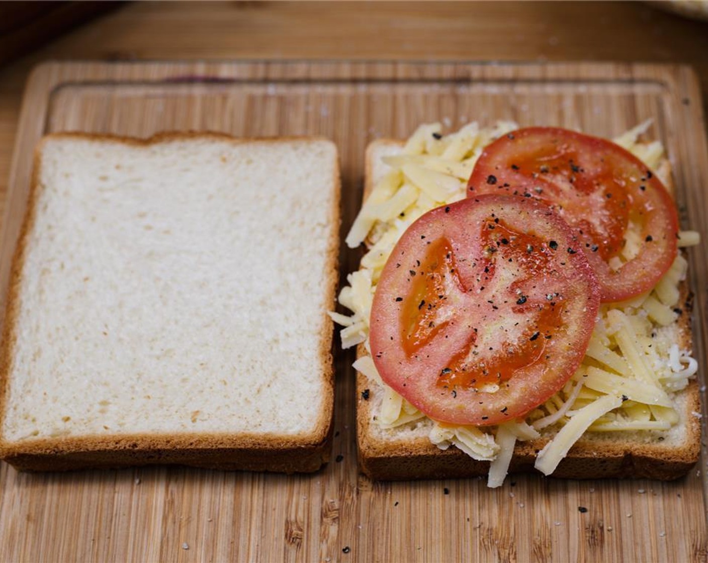 step 6 Top with two slices of tomato and season with Salt (to taste) and Ground Black Pepper (to taste).