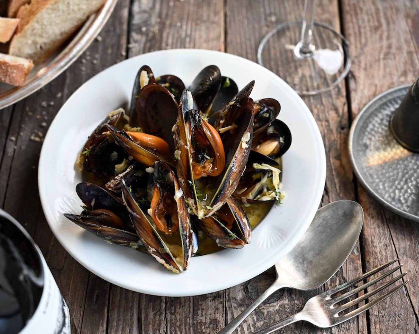 step 6 Stir the mussels through the sauce and divide between four warmed bowls. Serve the mussels immediately with lemon wedges to squeeze over the top, fresh crusty bread to mop up the sauce and a chilled bottle of Vriesenhof wooded Chardonnay.