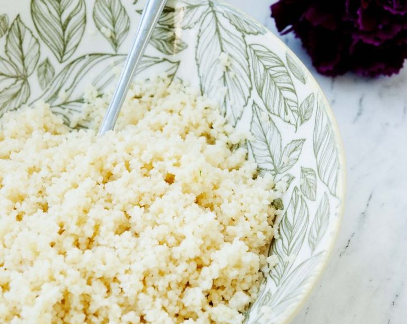 step 7 Using a fork gently fluff the couscous. Stir in the Coconut Cream (1 Tbsp) and Coconut Oil (1 Tbsp)