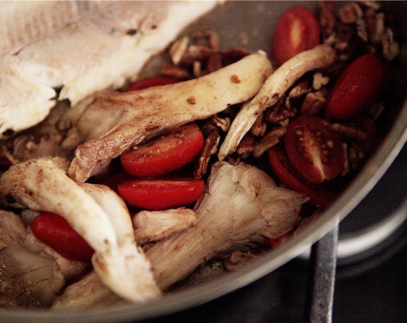 step 6 Add Pecans (4 Tbsp) pieces to the trout pan and toast/brown for 1-2 min, add Oyster Mushroom (1/2 cup), Unsalted Butter (1 Tbsp), Ground Black Pepper (to taste), Simply Organic Cinnamon, Ground (1/8 tsp), Ground Cumin (1/4 tsp), and Cayenne Pepper (to taste). Cook while stirring 3-4 min, or until tender, add Cherry Tomatoes (16), Kosher Salt (to taste), and Black Pepper (to taste).