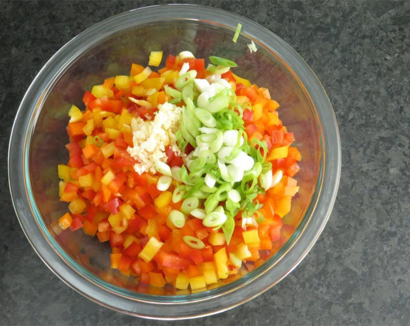 step 4 Add bell peppers, scallions, and garlic. Toss to coat. Cover and refrigerate overnight. The next day, drain the black-eyed peas. Add Bacon (2 slices), Chicken Broth (4 cups), Water (2 cups), and Bay Leaves (3). Bring to a boil.