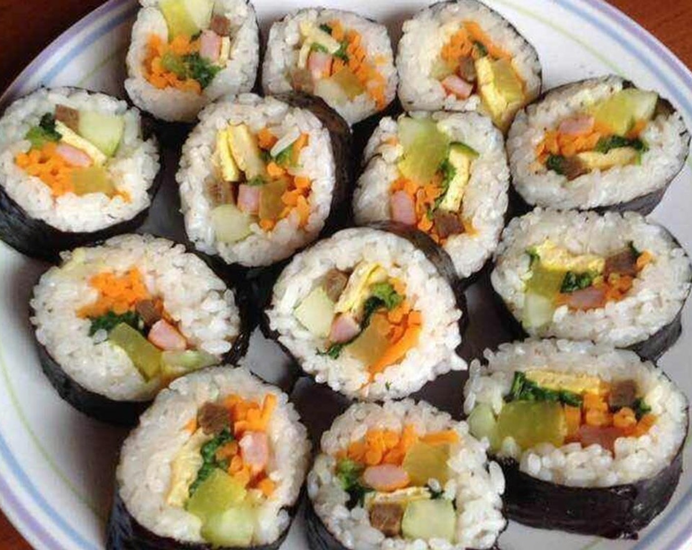 step 12 Remove the bamboo mat and with a clean, sharp knife, cut the roll into equal slices. Enjoy!