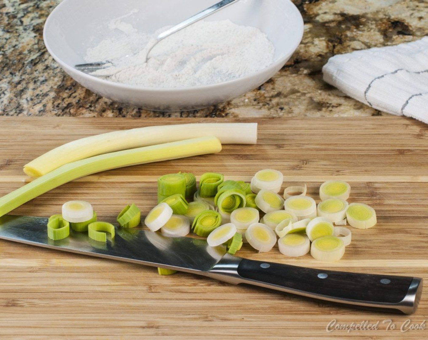 step 11 Trim ends from Leek (1) and rinse well, making sure to rinse under any loose leaves. Cut leek into 1/4 inch slices and separate rings.