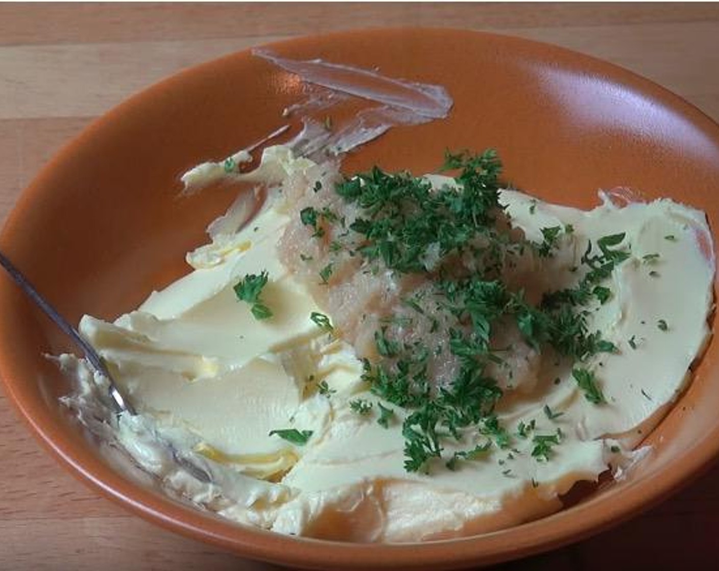 step 2 In a large mixing bowl, add Butter (1/2 cup), Garlic (1 clove) and Fresh Parsley (to taste). Gently mix until combined.