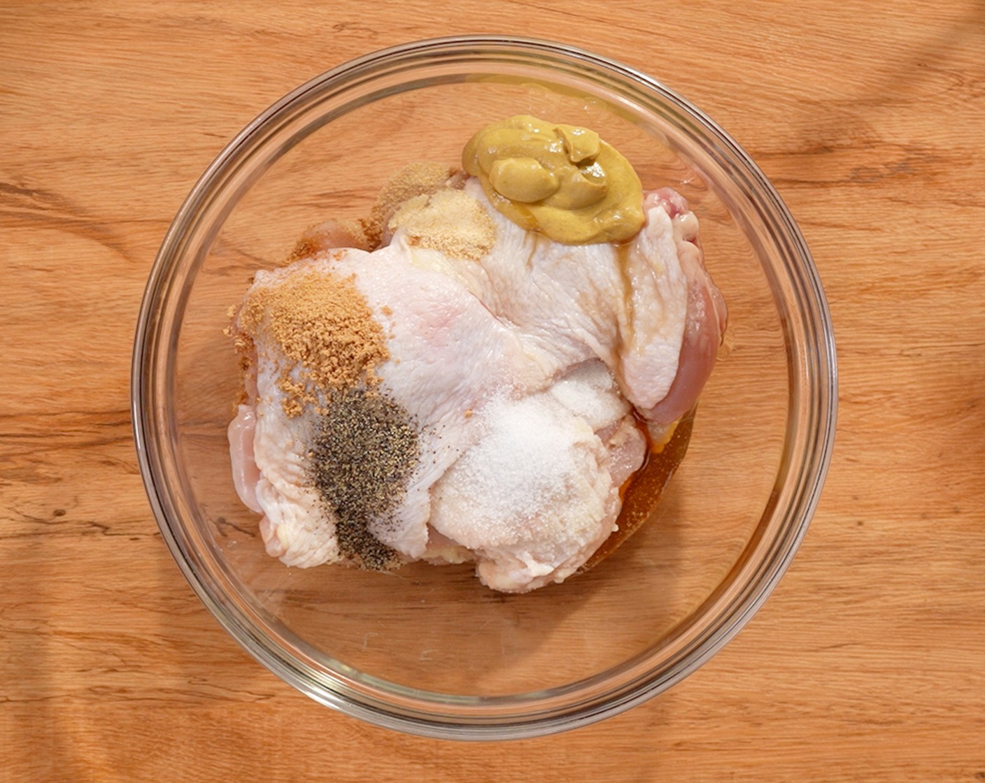step 2 Marinade the Boneless, Skinless Chicken Thighs (2 lb) in Dijon Mustard (2 Tbsp), Honey (1 tsp), Simply Organic Garlic Powder (1 tsp), Simply Organic Onion Powder (1 tsp), Salt (1 tsp), and Ground Black Pepper (1/2 tsp). Keep in the fridge for at least 15 minutes.