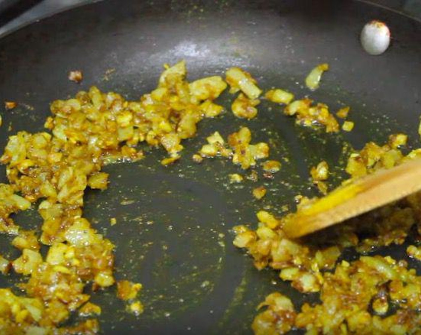 step 2 Add Garlic (2 cloves) and Curry Powder (2 tsp). Cook, stirring, for 25 seconds.