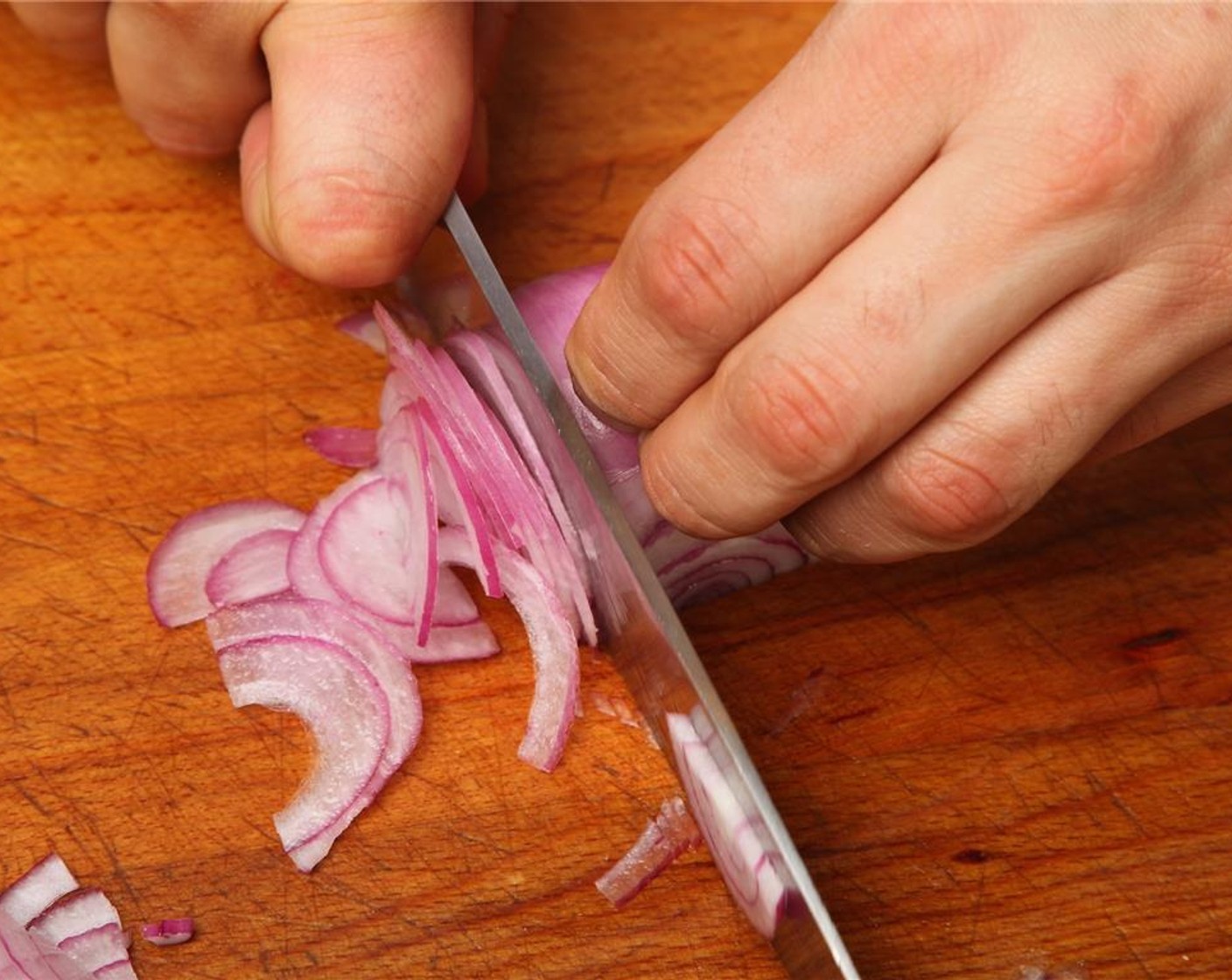 step 4 Thinly slice half of the Red Onion (1/2) and dice the other half. Set aside. Thinly slice the Fresh Cilantro (4 pieces).