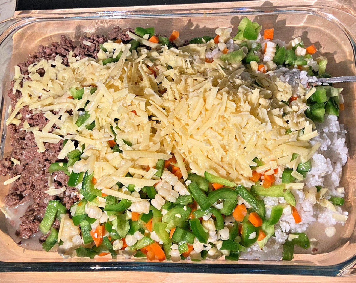 step 5 Combine the cooked beef with the cooked White Rice (2 1/2 Tbsp), Mixed Vegetables (1 cup), Shredded Cheddar Cheese (1 cup), and Chicken Stock (1 1/2 cups).