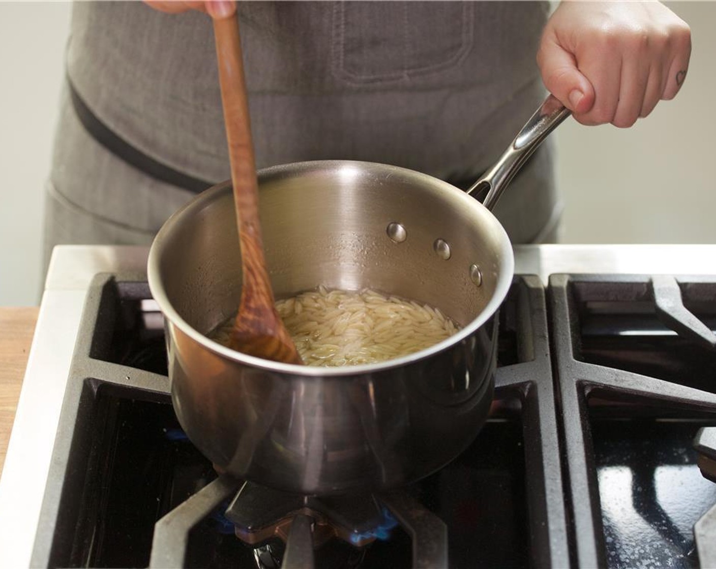 step 6 When the water comes to a boil, add the Orzo Pasta (2/3 cup) and cook for 9 minutes, or until desired texture. Drain the pasta in a colander and then return pasta back to pot. Keep warm for plating.