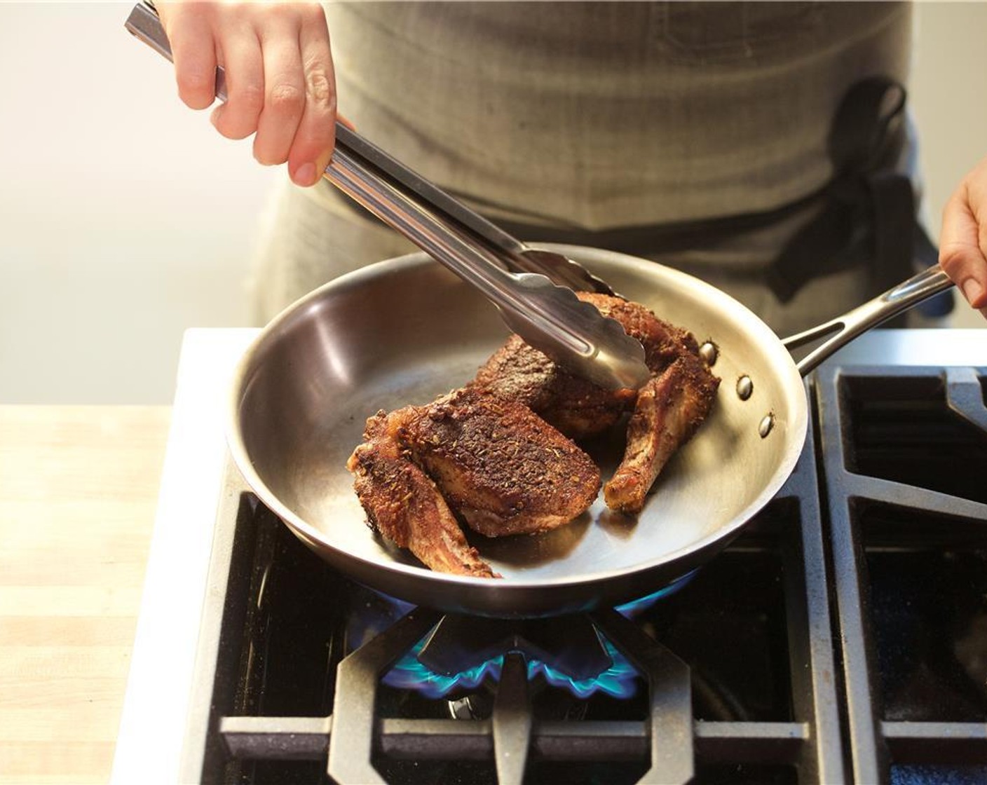 step 16 Turn the heat to medium and turn the duck over, cooking for an additional seven minutes.