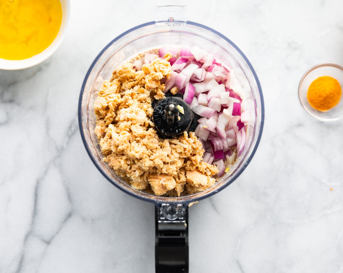 step 2 Blend Gluten-Free Rolled Oats (1 cup) in a food processor until a panko-like texture is formed. Add the Salmon (1 can), Red Onion (1/2 cup), Carrot (1/4 cup), Garlic (1 tsp) and blend until combined.