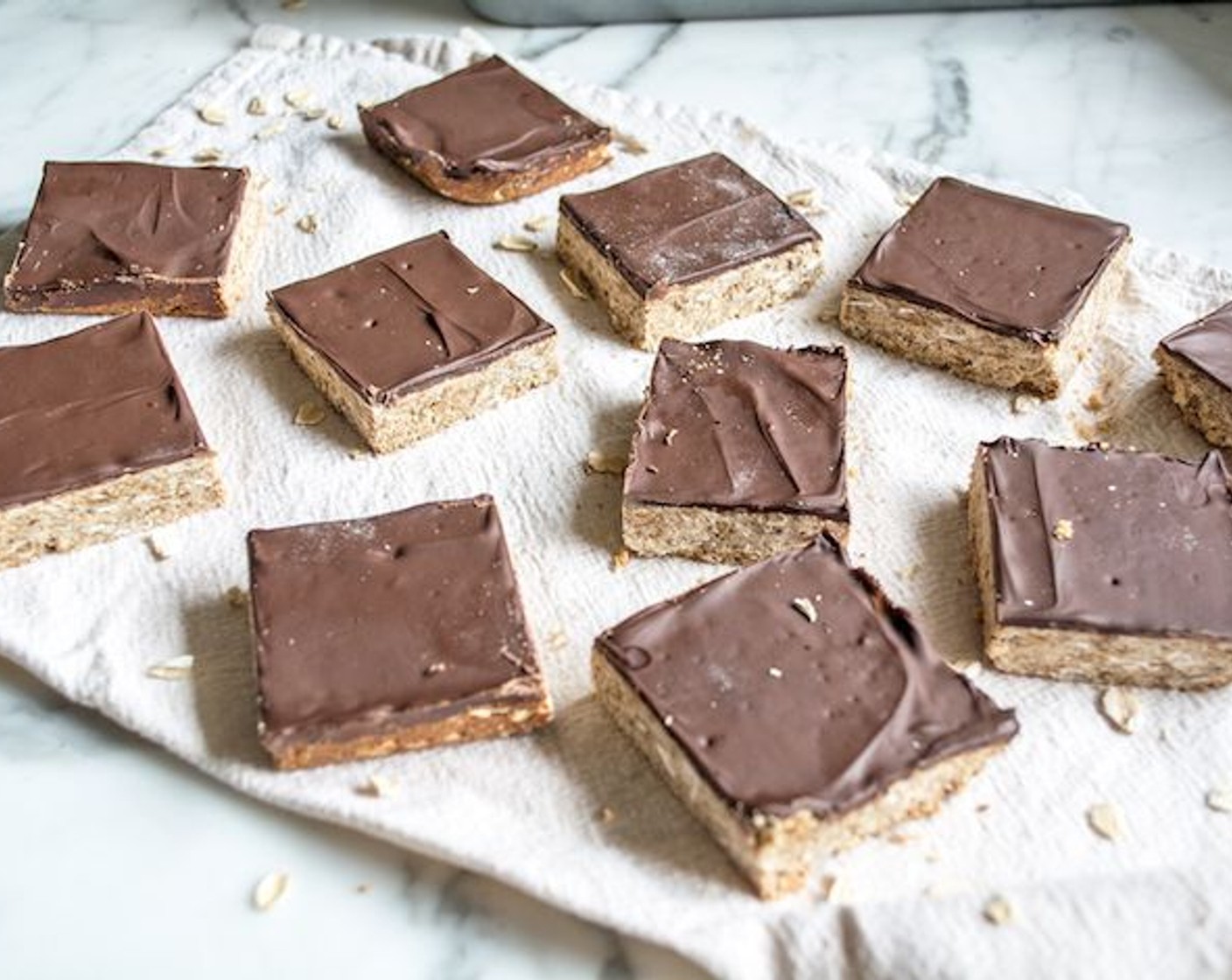 step 7 Remove from oven and spread chocolate chips into a smooth layer. Put in freezer for about 10 minutes or until chocolate has hardened. Cut into 24 squares and store in airtight container.