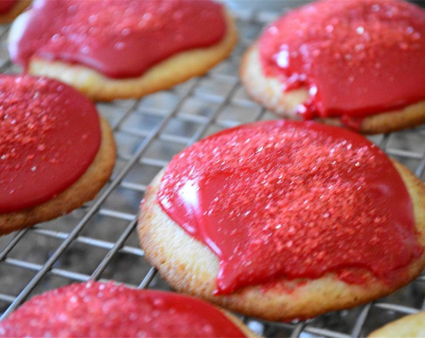 step 10 Once cooled, spread a small spoonful of the glaze over each one and sprinkle them with the Red Colored Sugar (to taste) on top before the glaze hardens completely.