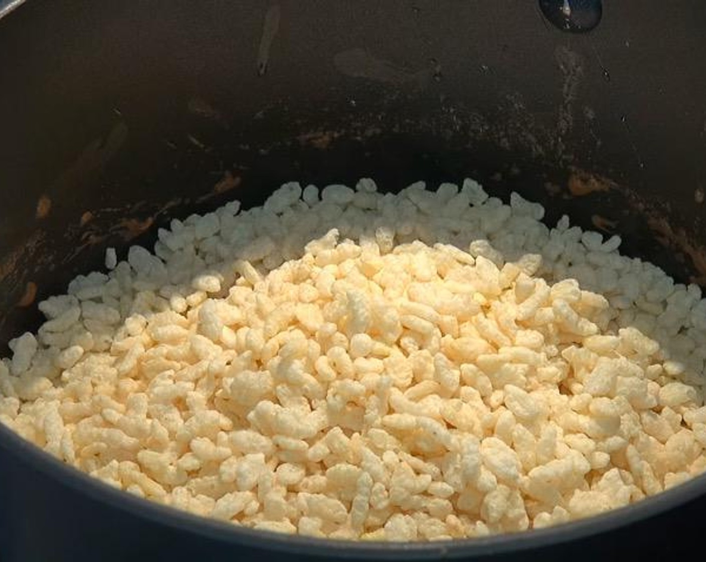 step 2 Add in the Puffed Rice Cereal (3 cups). Stir together.