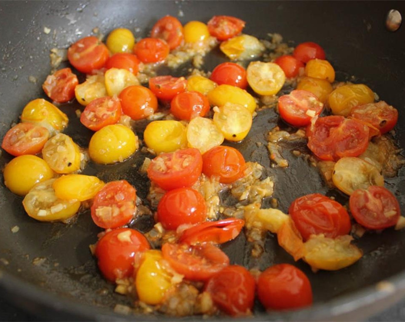 step 11 Add the Cherry Tomatoes (2 cups) to the pan and cook for about 4 minutes until the tomatoes start to burst. Crush a couple tomatoes with a spatula to release some extra juice. At this point, I like to remove a third of the tomatoes from the pan to serve on top of the cutlets, but this optional.