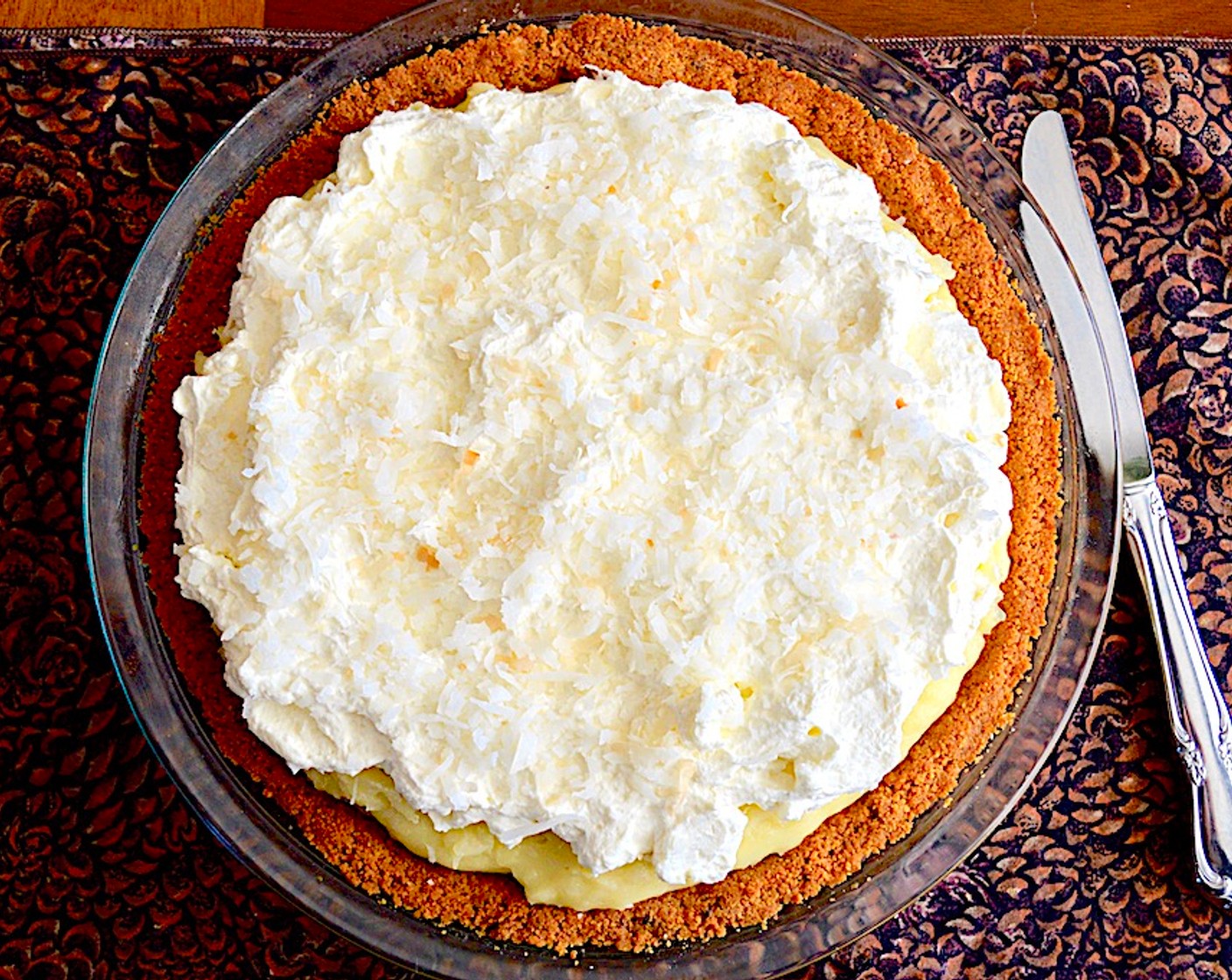 step 8 Spread the coconut cream evenly in the cooled graham cracker crust and chill the pie for at least 4 hours. Then top it with a generous layer of Whipped Cream (to taste) and sprinkle the remaining toasted coconut on the very top. Serve and enjoy!