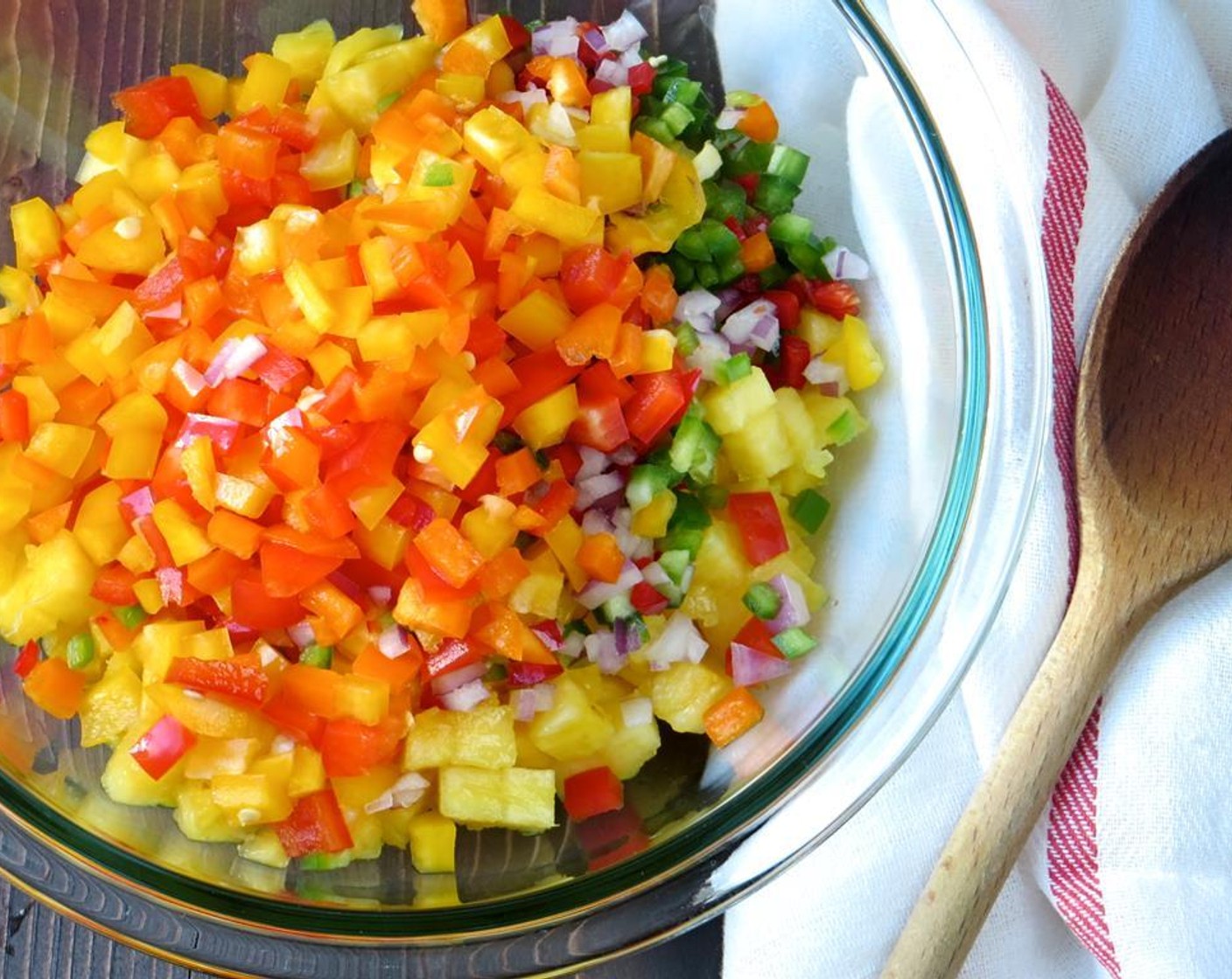 step 7 In a medium bowl combine the diced, mango, pineapple, bell peppers, red onion, jalapeño and chili pepper. Toss to combine.