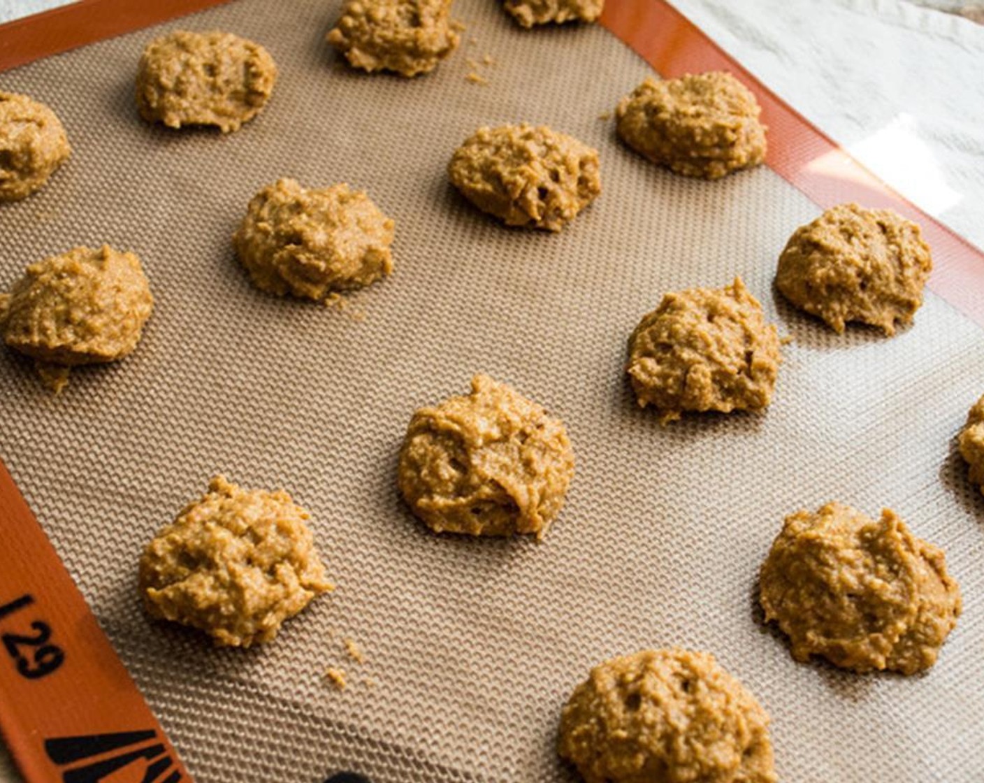 step 5 Pour oat flour mixture into the butter mixture and stir until just mixed. Use a small spoon and scoop out 40-42 small mounds on to a baking sheet lined with parchment paper. Bake for approximately 9 minutes, until slightly springy and a toothpick comes out clean.