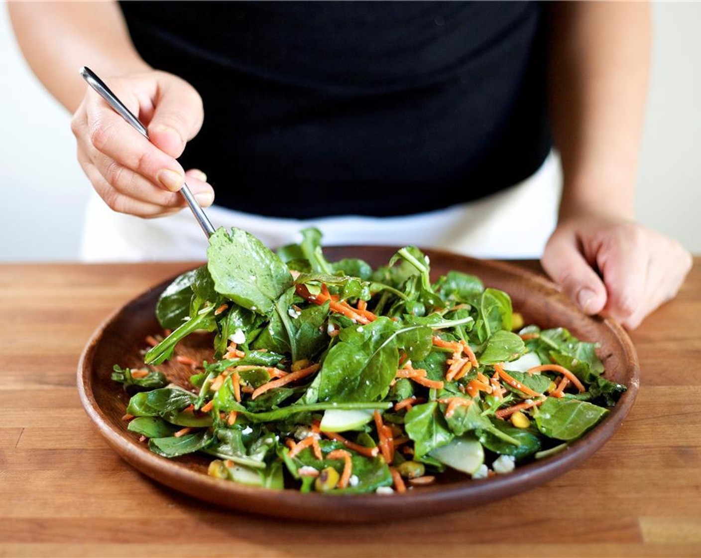 step 8 In the center of two plates, gently stack the arugula salad.