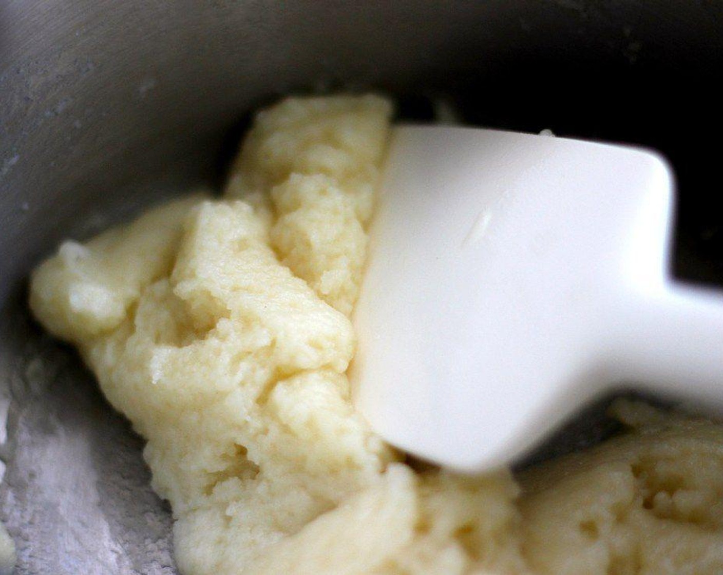 step 3 Once the mixture is boiling, add All-Purpose Flour (1/2 cup) and stir with a spatula. Stir until a there is a thin coating of dough on the saucepan.