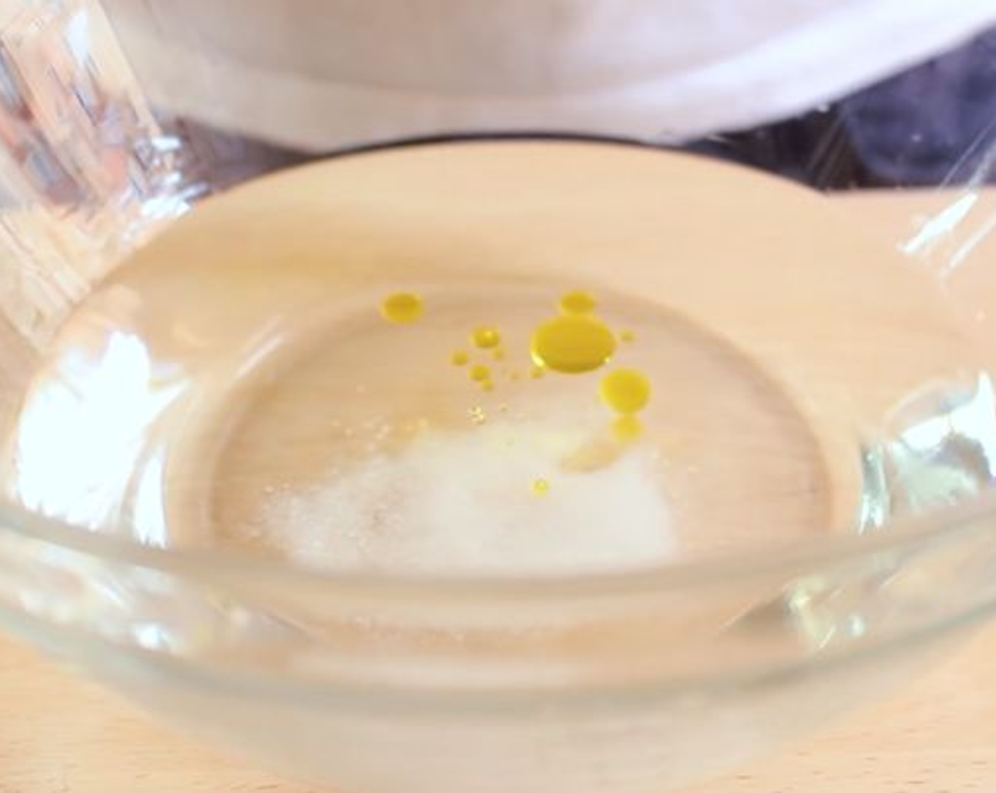 step 1 In a large bowl add Water (2 1/2 cups), Salt (1 tsp), Oil (1 Tbsp) and mix.
