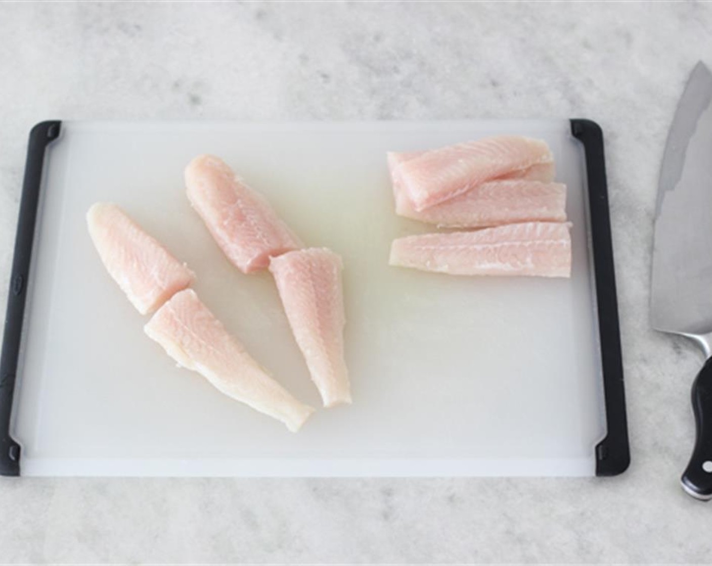 step 2 Cut the Cod Fillets (1.5 lb) into 1-11/2 inch thick strips. Season the fish on both sides with Salt (to taste) and Freshly Ground Black Pepper (to taste).