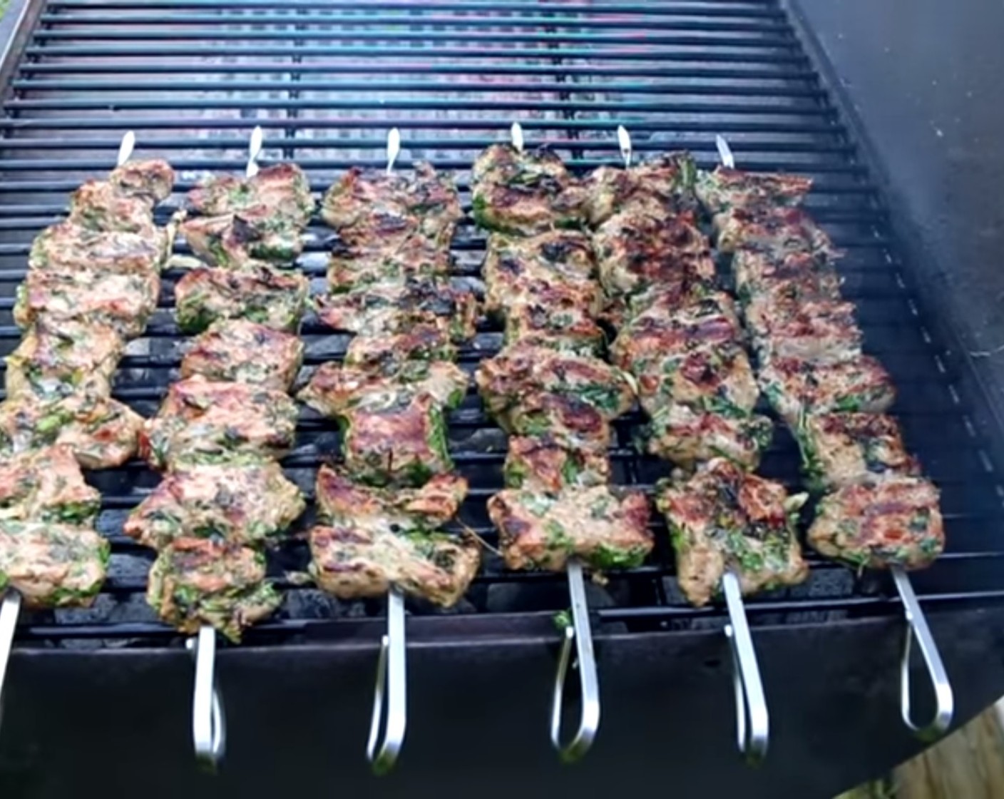 step 8 Place the skewers on the working grill. Occasionally rotate them to let the meat cook from all sides.