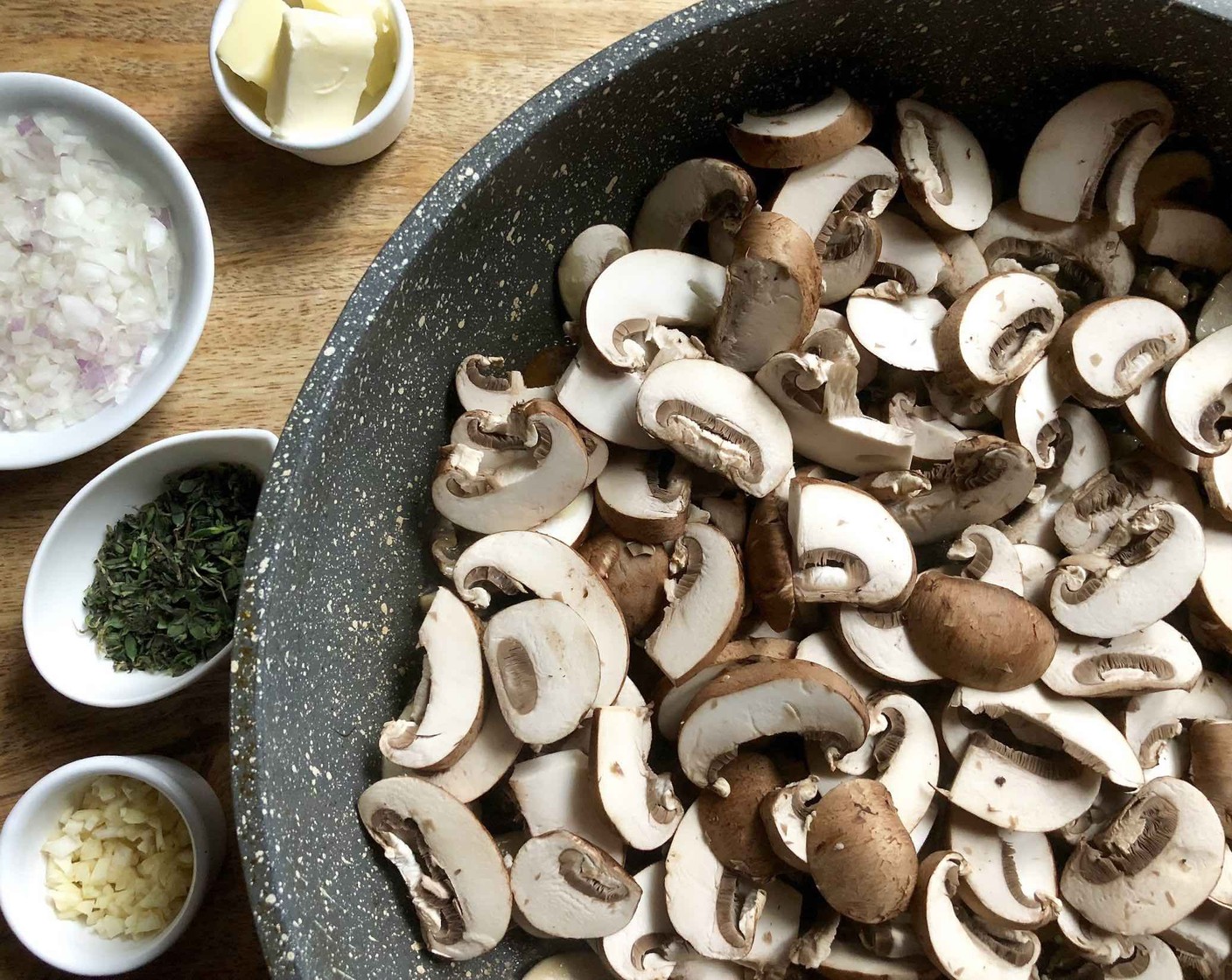 step 4 Heat the Olive Oil (2 Tbsp) in a large skillet over medium-high heat, then add the Baby Bella Mushrooms (4 cups) and cook until reduced in size, stirring occasionally, about 5 minutes.