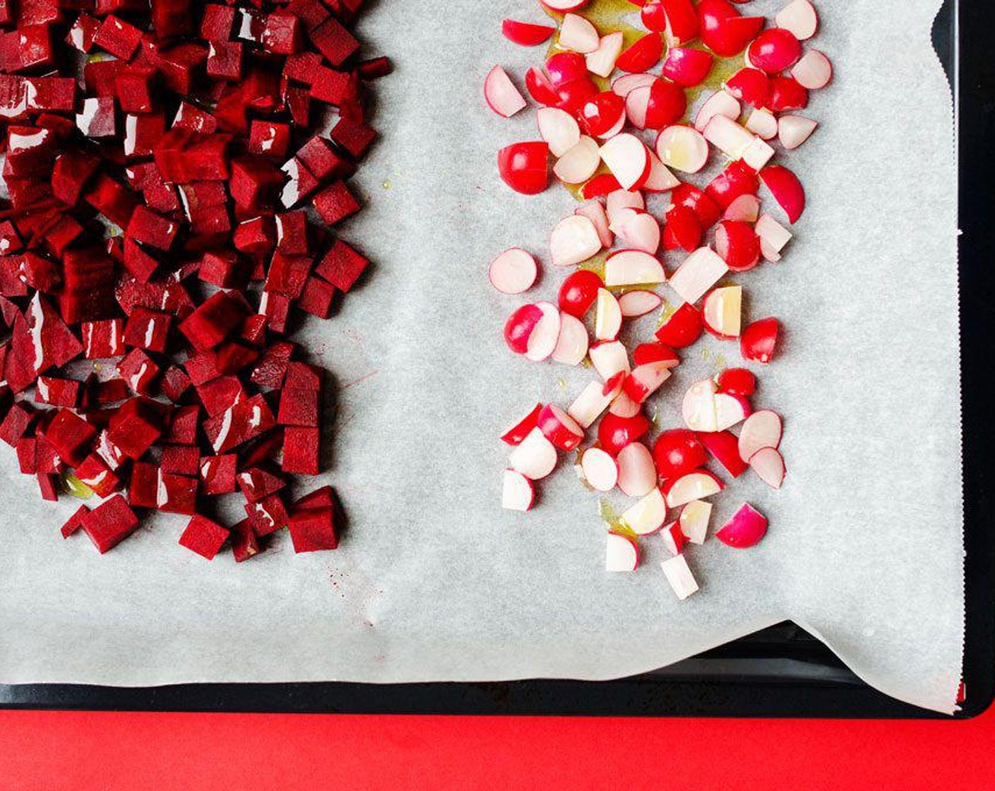 step 2 Spread Beets (2) and Radish (1 cup) onto a parchment paper-lined baking sheet. Drizzle with Olive Oil (2 Tbsp) and season with Salt (to taste) and Ground Black Pepper (to taste) tossing around a bit to evenly coat.