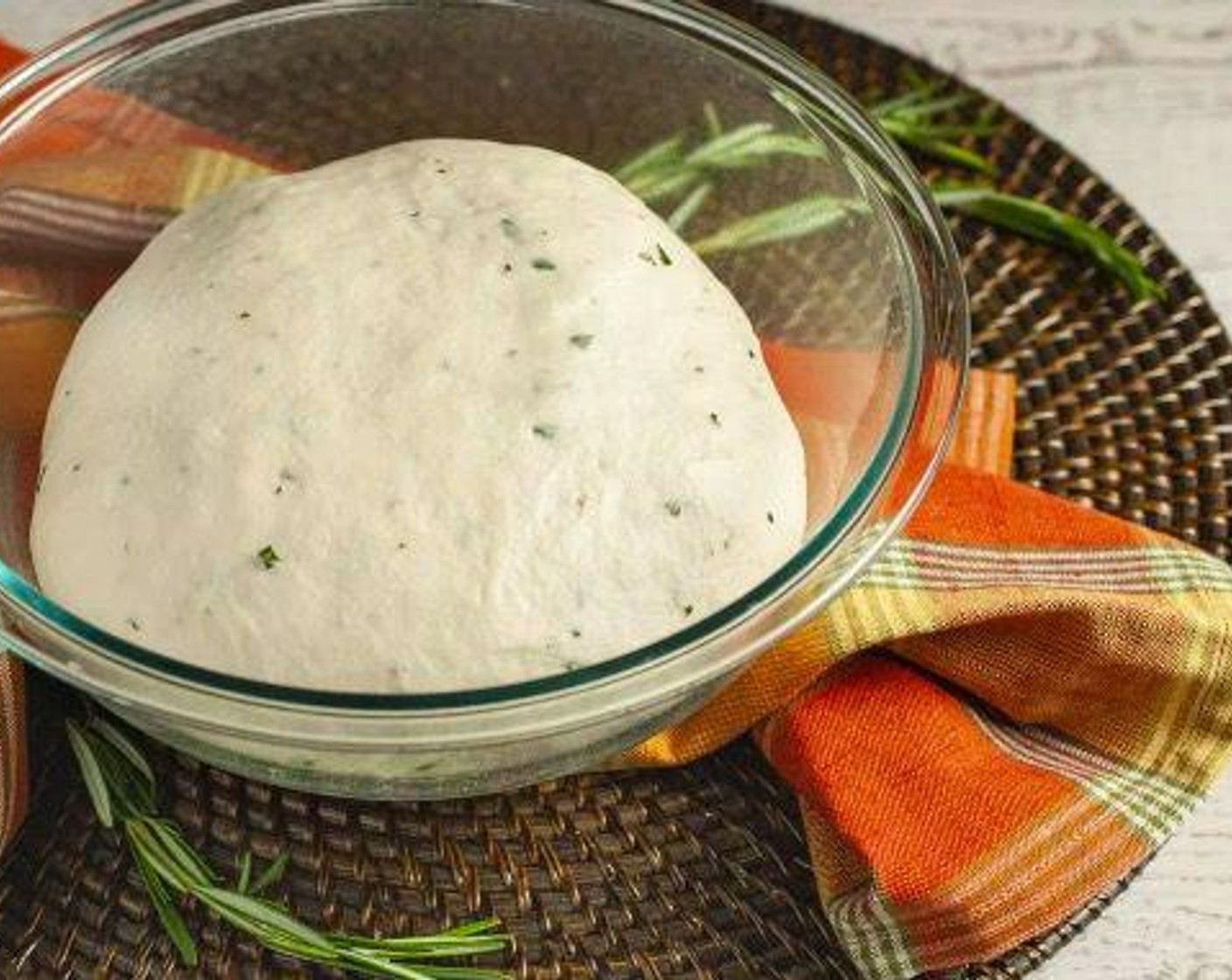 step 5 Place dough in a lightly oiled bowl and cover with plastic wrap or kitchen towel. Allow dough to rise in a warm, draft-free area until doubled in size, approximately 60 minutes.