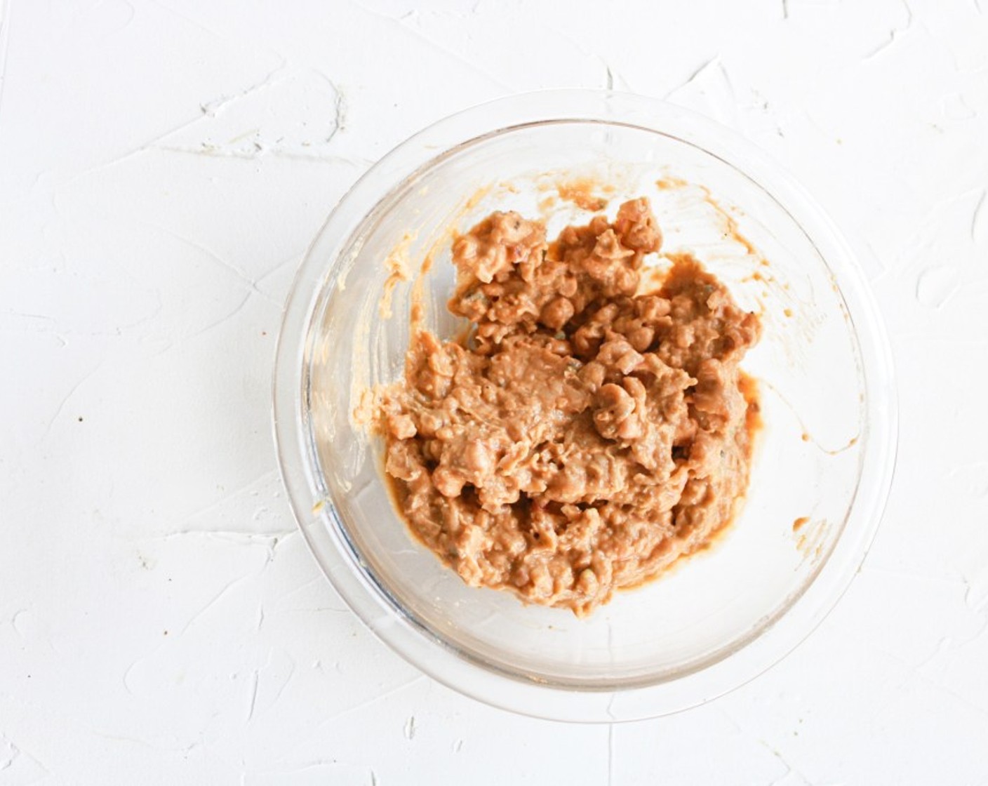 step 2 Fold in the Vegan Mayonnaise (1 tsp), Avocado (1/2), Red Onion (1 Tbsp), Buffalo Sauce (3 Tbsp), Hot Sauce (1 Tbsp), Ground Black Pepper (1/4 tsp), and 1 tsp of juice of a Lemon (1) until they are fully combined.