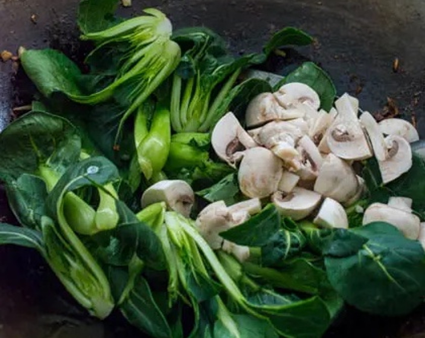 step 5 When the chicken is fully cooked, remove the chicken from the wok. Add Baby Bok Choy (3 cups) and Mushroom (1 cup) to the wok. Stir fry for about 1 minute.