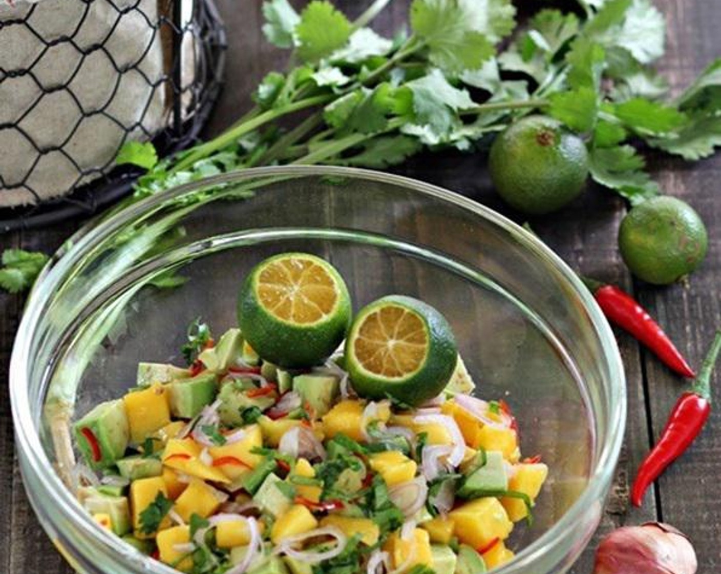 step 1 Mix Mango (1), Avocado (1), Shallot (1), Red Chili Pepper (1), Fresh Cilantro (2 Tbsp) together in a bowl and squeeze Limes (2) over it and mix well.