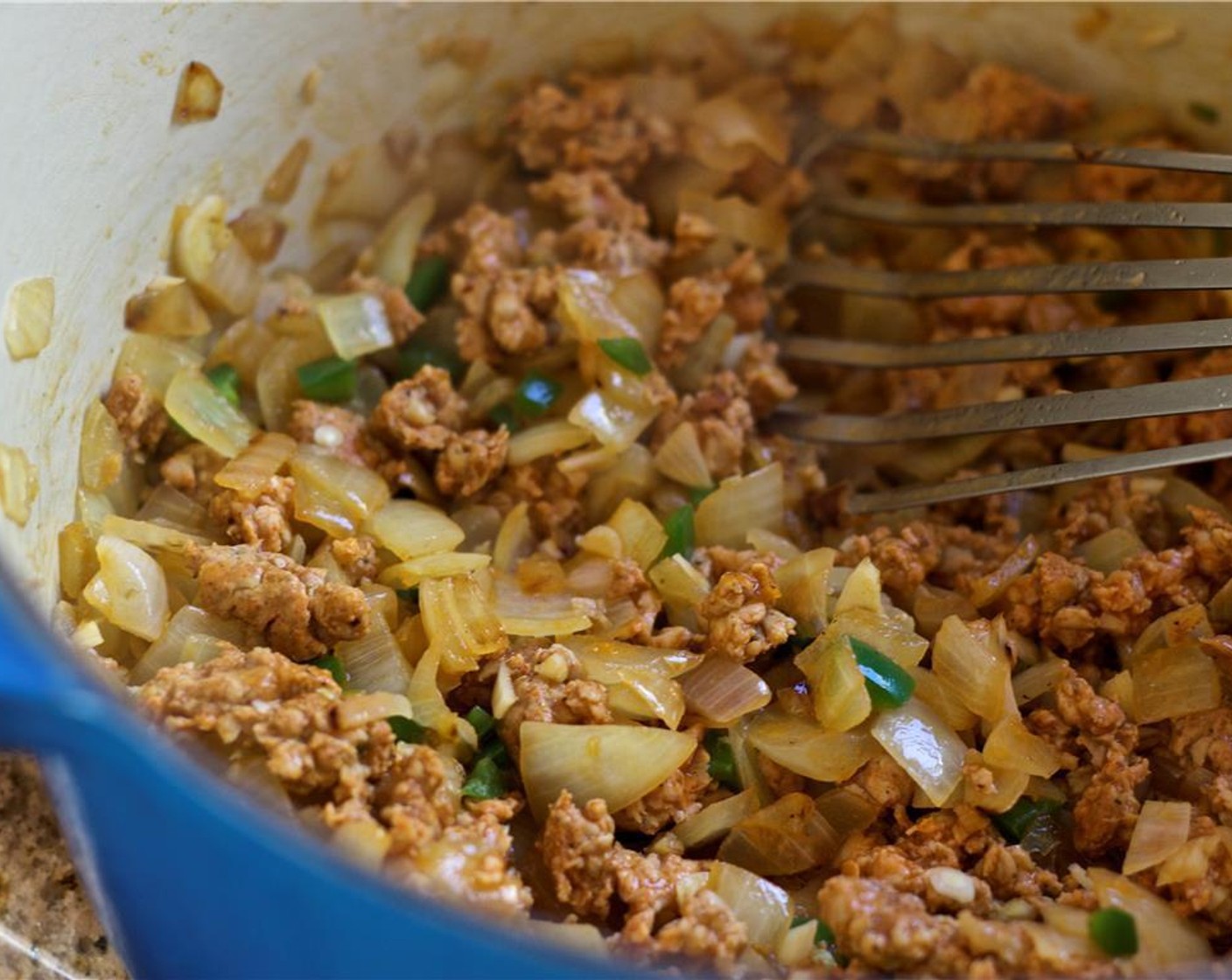 step 4 Toss in the garlic, jalapeño, and chorizo. Then sauté for about a minute.