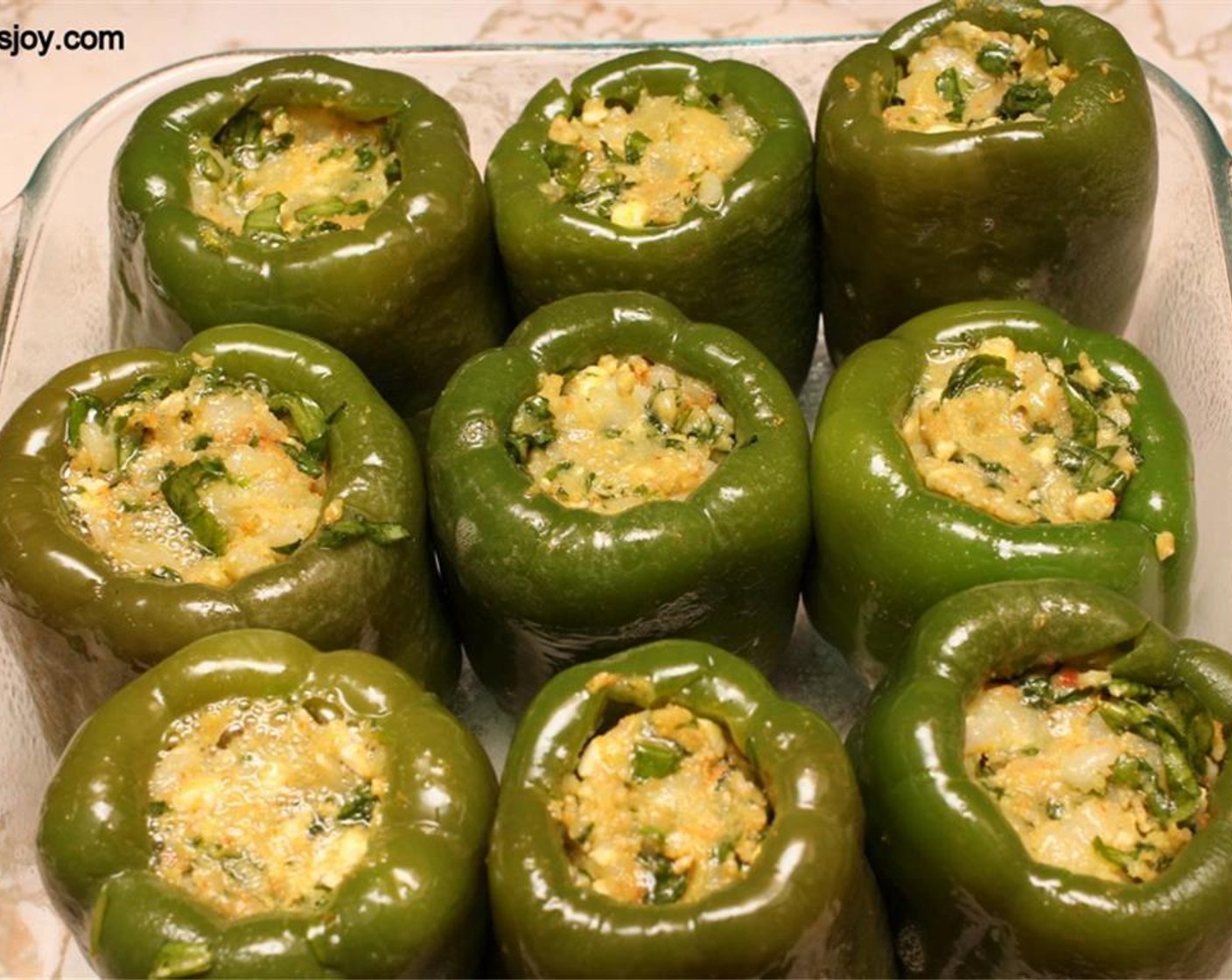 step 5 Remove the peppers and stuff them with the filling. Place the peppers on a greased baking sheet and bake for 30 - 40 minutes until the skin looks shriveled.