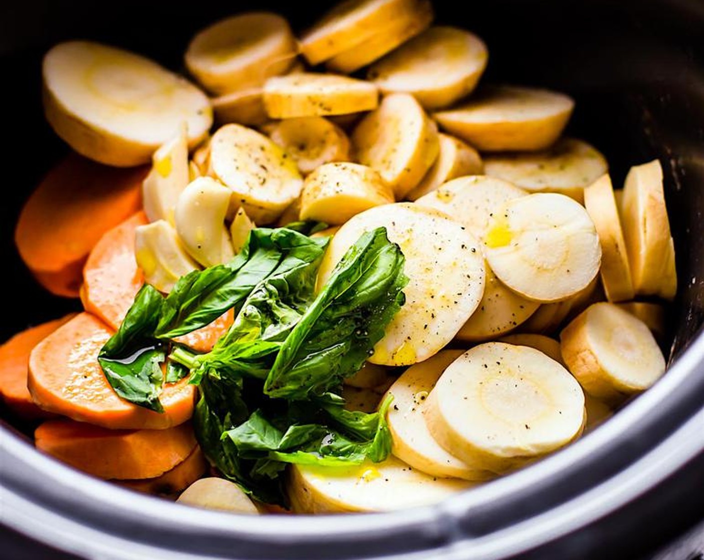 step 2 Place veggies in crock pot with Chicken Broth (1 1/2 cups), Fresh Basil Leaves (4), Garlic (4 cloves), Olive Oil (1 Tbsp), Sea Salt (1 tsp) and Ground Black Pepper (1/2 tsp).